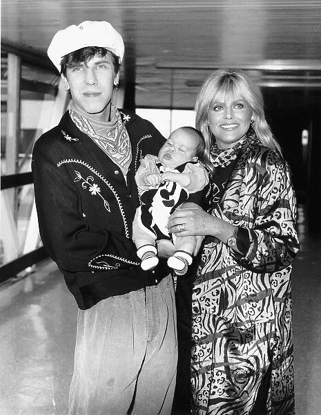 Britt Ekland with her toy boy Jim McDonnell and their baby for the openning of her film