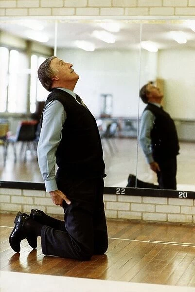 Bruce Forsyth TV Presenter and Comedian exercising in gymnasium