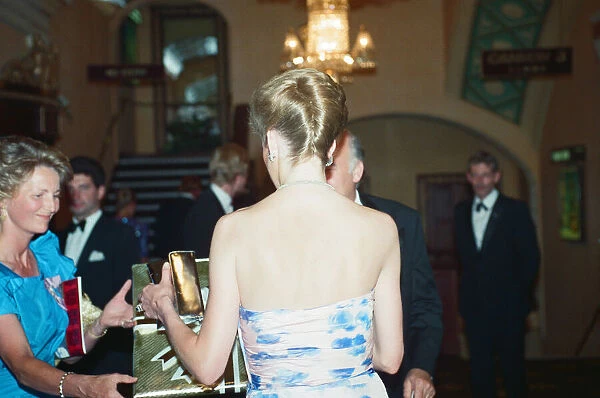 Back to camera, HRH Princess Diana, Princess of Wales attends the Premiere of Farewell to