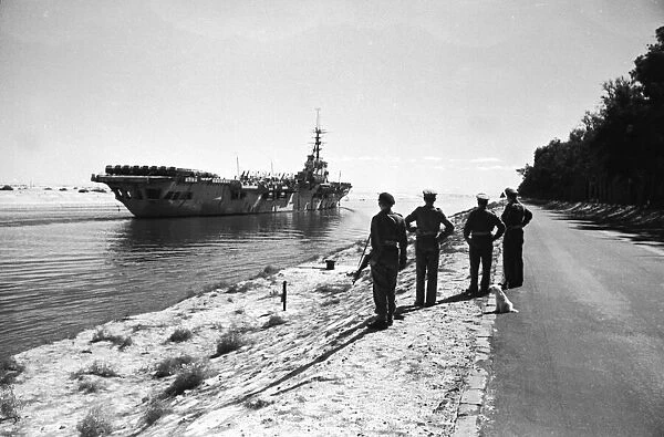 Canal Zone 1952 The Aircraft Carrier HMS Vengence passes through the Suez Canal