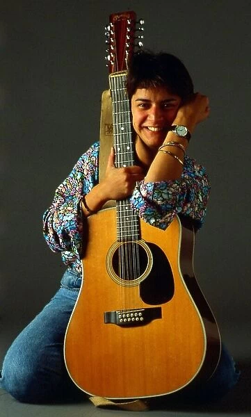 Carol Laula holding guitar October 1989