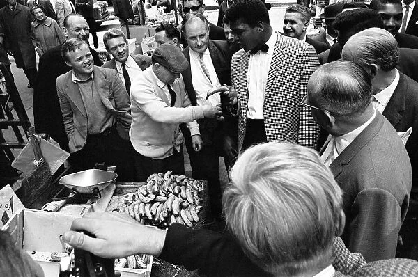 Cassius Clay aka (Muhammad Ali) walks around a market in Soho on the day of his arrival