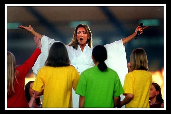 Celine Dion at Murrayfield Edinburgh July 1999 Arms wide holding microphone