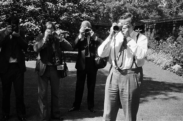 Chancellor of the Exchequer Denis Healey with photographers in the garden of Number 11