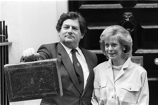 CHANCELLOR OF THE EXCHEQUER NIGEL LAWSON WITH HIS WIFE THERESE ON BUDGET DAY OUTSIDE