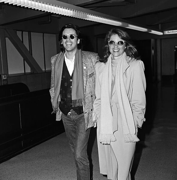 Charlotte Rampling and her husband Jean-Michel Jarre arriving at Heathrow Airport