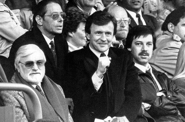 Chelsea chairman Ken Bates and manager John Hollins sit together in the first half of