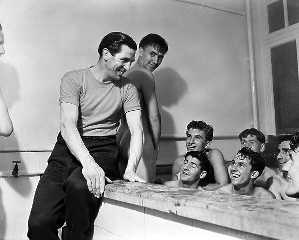 Chelsea football manager Ted Drake talking to his players in the bath