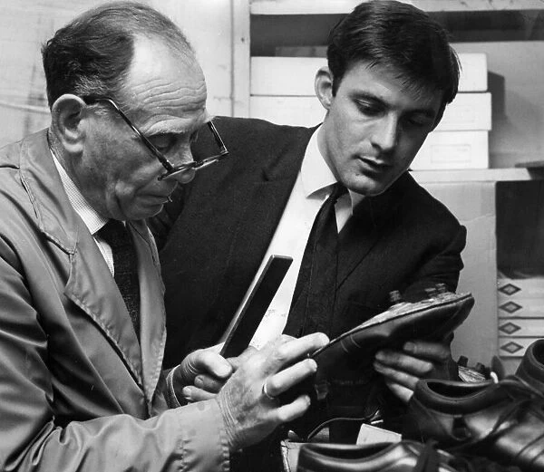 Chelsea forward Bobby Tambling watches as his boots are specially made ahead of the 1967