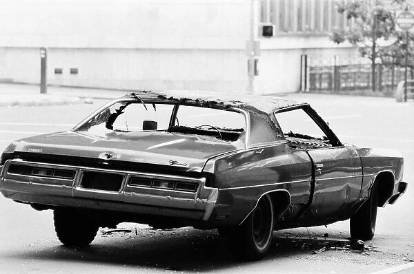 Chevrolet Nova, abandoned and vandalised on the streets of New York, USA, June 1984