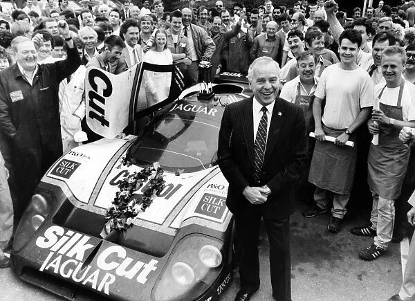 Chief executive of Jaguar Cars, Sir John Egan, with the car which won the Le Mans 24 hour