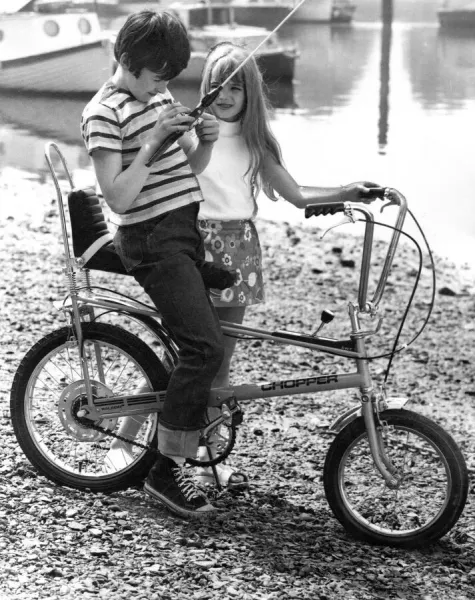 Children playing in the 1970s on a chopper bicycle bike