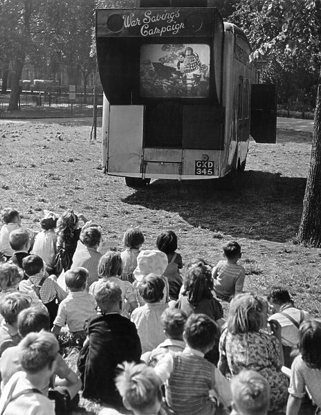 Children watch an open air cinema performance of Ralph Readers 'Gang Show'