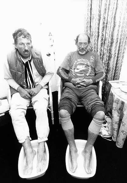 chris lander and Ian Botham soak their feet after a charity walk