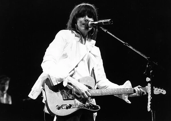 Chrissie Hynde singer with The Pretenders pop group 1987 playing guitar in concert