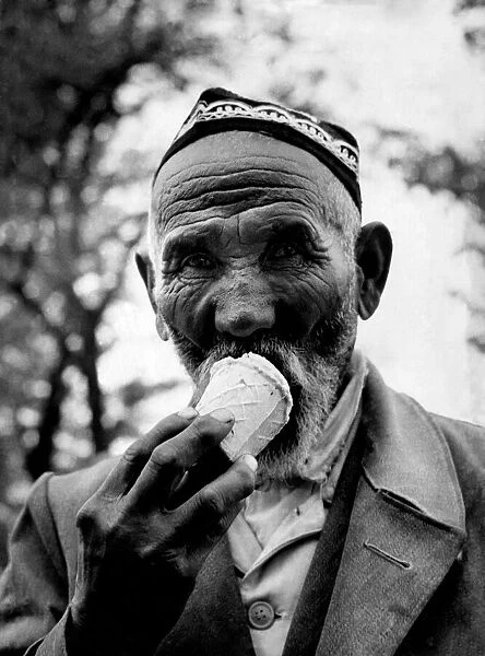 A citizen of one of the U. S. S. R. central states seen here enjoying an ice cream