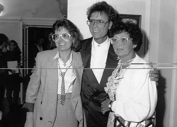 Cliff Richard singer actor with his mother and sister at a party celebrating 30 years in