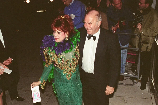 Clive James arrives for the 1995 Comedy Awards with Margarita Pracatan