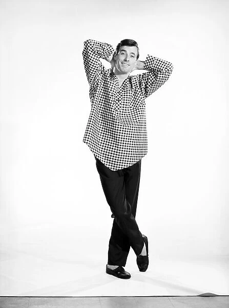 Clothing: Fashion: Menswear: Man wearing Pyjamas. Model: Peter Anthony. 1962 B1438b-004