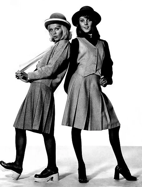 Clothing: Two little girls in grey all set for autumn. Jenny, on the right