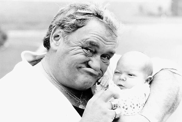 Comedian Les Dawson with baby Alexander Rigby 1987