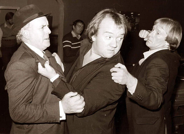 Comedian Mel Smith in a scuffle with stars of the television series Minder George Cole