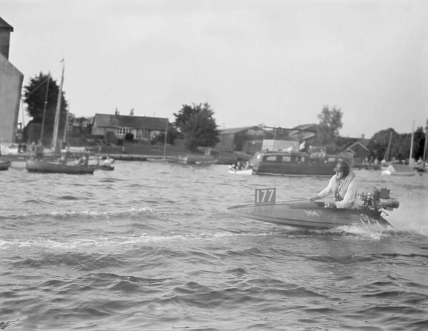 Competitor taking part in the Daily Mirror Handicap Trophy Race for outboard hydroplane