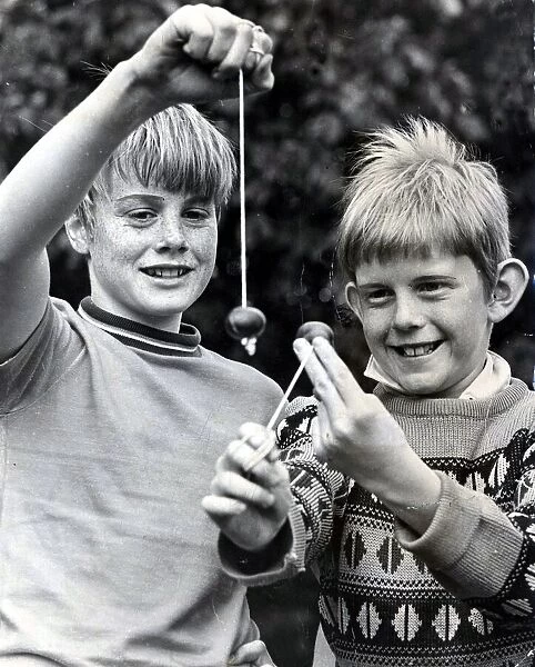Conkers - Two young lads playing conkers. 25 September 1970