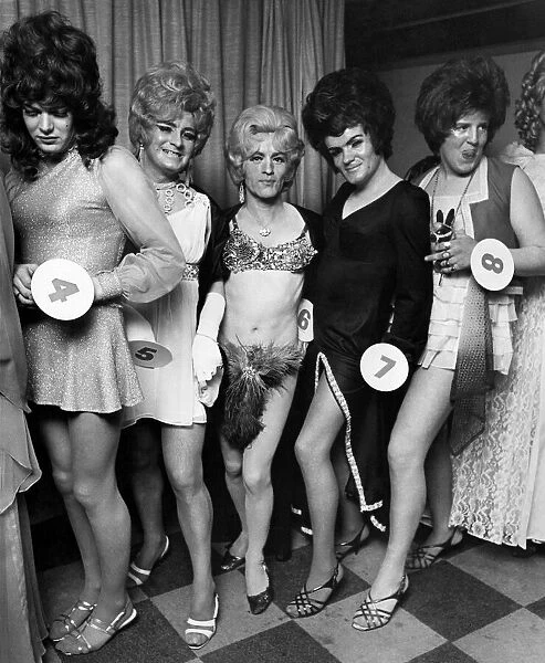 Contestants line up for the contest to find the best female impersonator