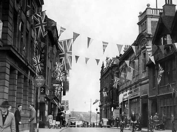 Coventrys High Street looking towards Earl Street is festooned with flags for the VE