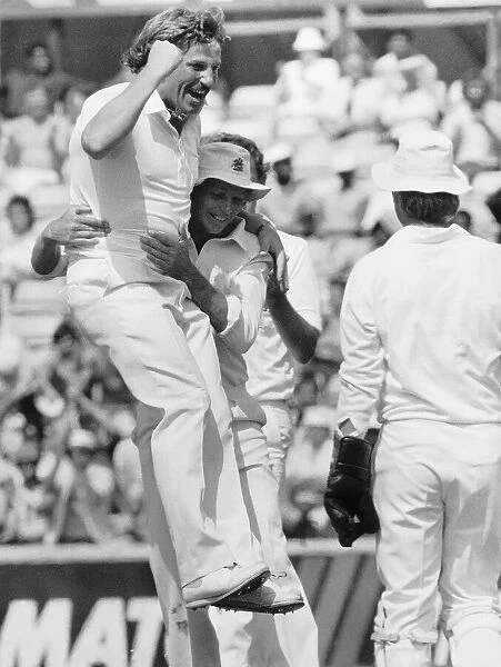 Cricketer Ian Botham celebrates with David Gower 1984 after taking his 300th Test Wicket