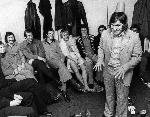 Crystal Palace footballer Peter Taylor entertains the rest of the squad with his Tommy