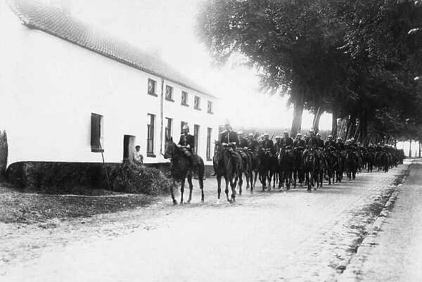 The Cuirassiers of the French cavalry seen here passing through a Belgium village during
