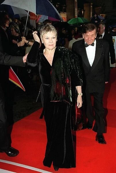 Dame Judi Dench actress and Michael Williams actor at the BAFTA Awards April 1998