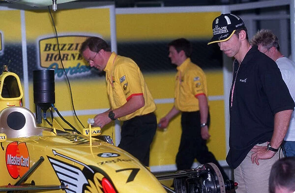 Damon Hill looks over his car. Formula One Grand Prix July 1999 Jordan Team