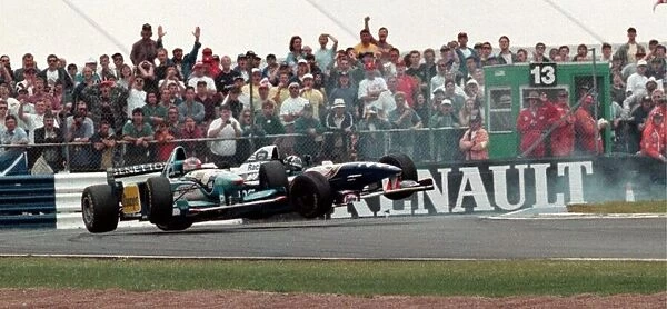 Damon Hill in a Williams and Michael Schumacher in a Beneton collide in the British Grand