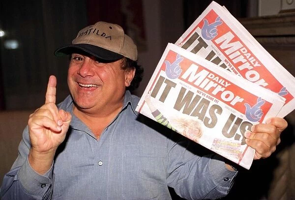 Danny DeVito Actor holding the Daily Mirror Newspaper