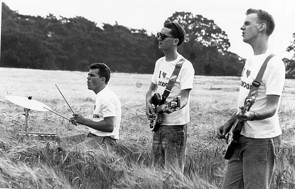 Dave Hemingway, Stan Cullimore and Norman Cook of the Housemartins filming a video at
