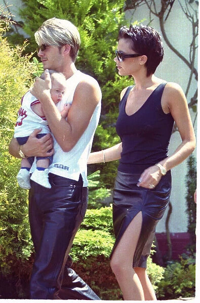 David Beckham and Posh Spice with baby Brooklyn July 1999 outside their home two days