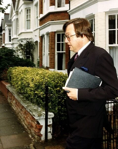 David Mellor Conservative MP looks worried as he leaves his Putney home
