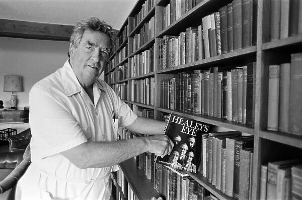 Denis Healey at his home in Sussex with one of his contributions to his library