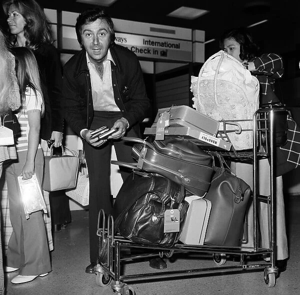 Des O Connor at the airport with his family. 3rd August 1974