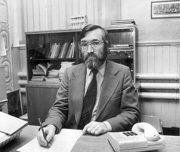 Drummond Middle School headmaster Ray Honeyford at his desk. 17th September 1985