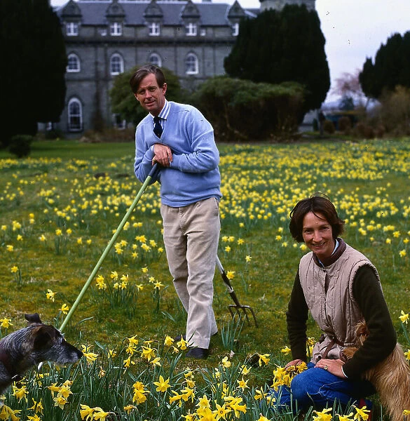 Duke and Duchess of Argyll in garden with dogs April 1988