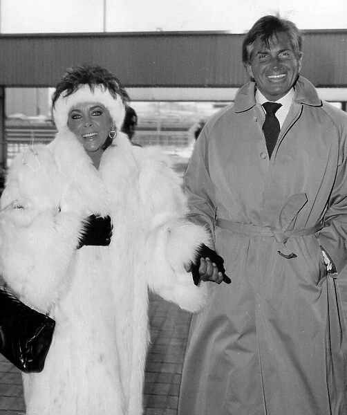 Elizabeth Taylor actress and George Hamilton at Heathrow Airport leaving for New York