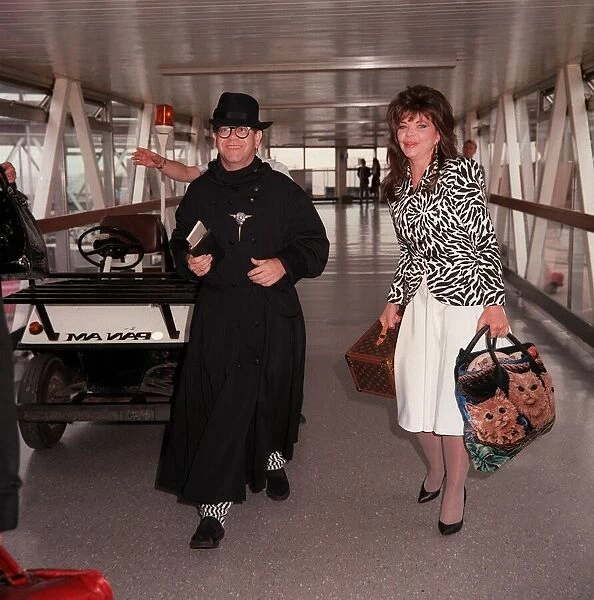 Elton John arriving at London Airport July 1987