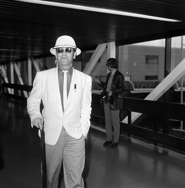 Elton John at Heathrow Airport. 6th August 1983