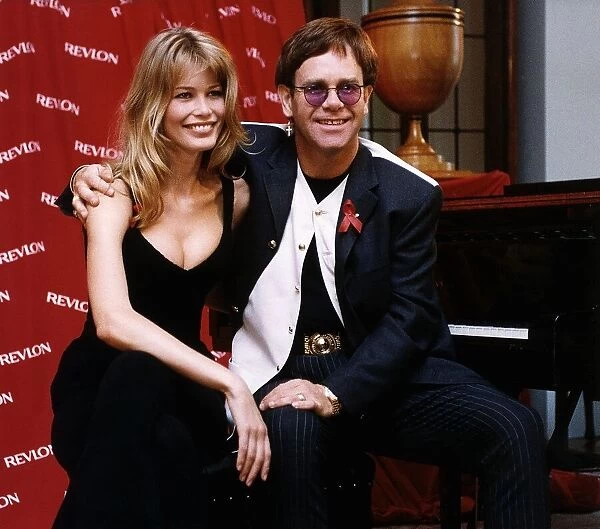 Elton John singer with model Claudia Schiffer