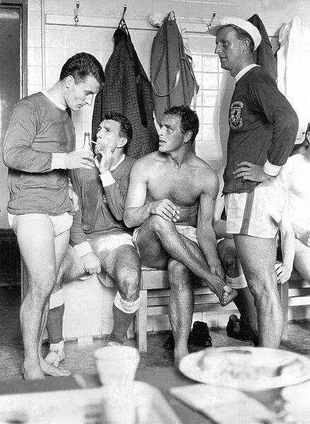 and enjoy a cigarette following their win over Scotland in their dressing room at Ninian