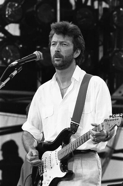 Eric Clapton performing on stage at the John F. Kennedy Stadium, Philadelphia